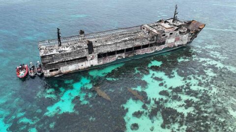 Aerial view of the burnt M/V June Aster off Coron, Palawan